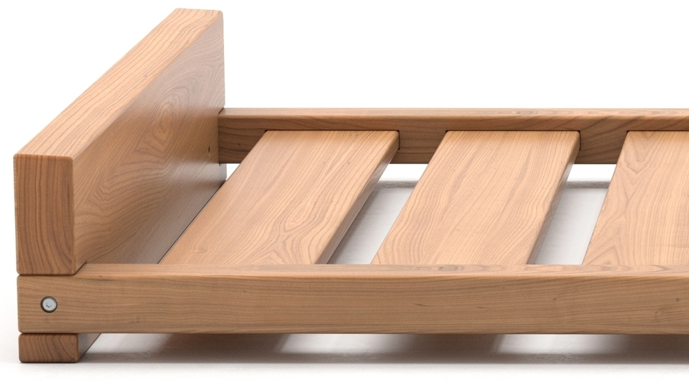 Closeup view of a solid wood Montessori bed
